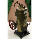 A brass Bing stationary steam engine.