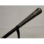 Antique umbrella with embossed floral design silver handle.