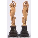 Pair of 19th century continental carved ivory classical figures and cherubs, unsigned,