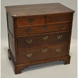 An Antique oak chest of 2 short and 3 long drawers,