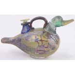 An unusual continental painted and gilded coloured glass decanter in the form of a duck,