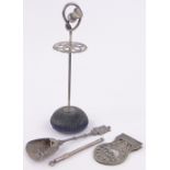 Group of silver items, including a thistle design hatpin stand, caddy spoon, etc.