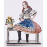 An Italian pottery figure of a young flower girl, circa 1950s, height 12".