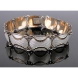 A Norwegian sterling silver and enamel silver gilt 10 panel bracelet, by J Tostrup.