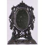A 19th century cast-iron framed toilet mirror, with armour and flag design surround, height 21".