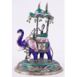 An Indian silver and coloured enamel caparisoned elephant, height 4.5".