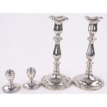 Pair of 19th century electroplate candlesticks, height 24cm and a pair of short silver candlesticks.