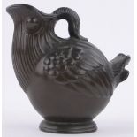 A bronze patinated metal ewer by Just Anderson, in the form of a stylised bird, height 5".