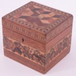 A Victorian Tunbridge Ware tea caddy, cube parquetry decorated lid with micro mosaic surround,