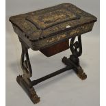 A 19th century Oriental black lacquered and papier-maché work table, with allover gilded decoration,