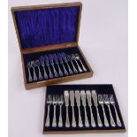 A cased set of silver fish eaters for 12 people, makers marks H A, Sheffield 1910, 33 oz total.