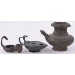 A 15th/16th century bronze water pot, height 5.5" and 2 bronze oil lamps, (3).