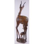 A large African carved hardwood antelope and calf, height 42".