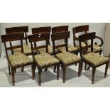 A set of 8 19th century mahogany dining chairs, with tablet top rails, upholstered drop-in seats,