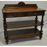 A Victorian carved oak 3-tier buffet, with raised back, 2 frieze drawers,