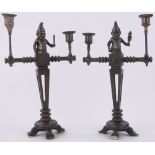 Pair of Arts & Crafts bronze Punch and Judy design candelabra, height 14".