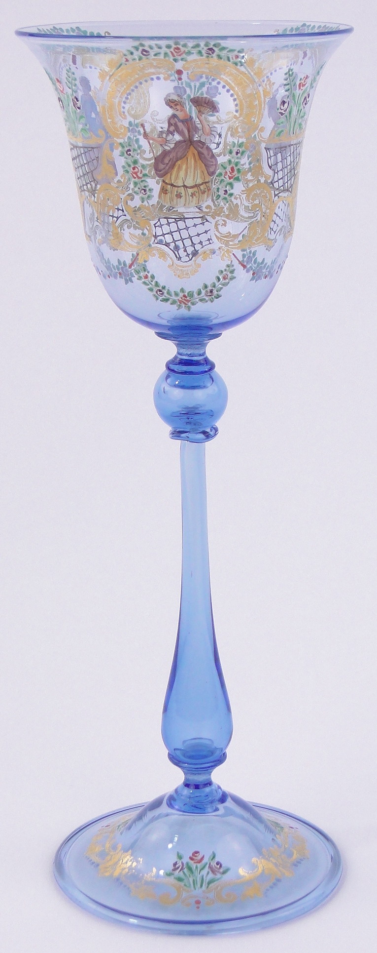 A delicate Venetian blue glass goblet, with painted enamelled and gilded figures, height 8.75".