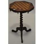 A 19th century rosewood games top occasional table on a spiral turned column and tripod legs,