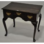 An Antique oak low boy, with 3 frieze drawers, shaped apron raised on cabriole legs, width 2'7",