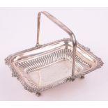 An Edwardian silver swing-handled fruit basket, Sheffield 1909, 28.5 oz.