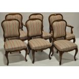 A set of 12 French walnut framed and upholstered dining chairs,