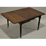An Antique mahogany extending Pembroke dining table, with one extra leaf, raised on fluted legs,