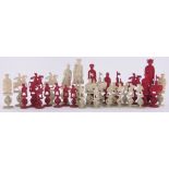 A 19th century Chinese red and white ivory puzzle ball chess set,