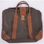 A Vintage Louis Vuitton monogram leather mounted suitcase, width 65cm.