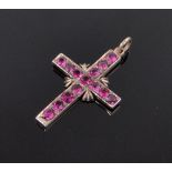 A 9ct gold ruby set cross pendant, length 27mm.