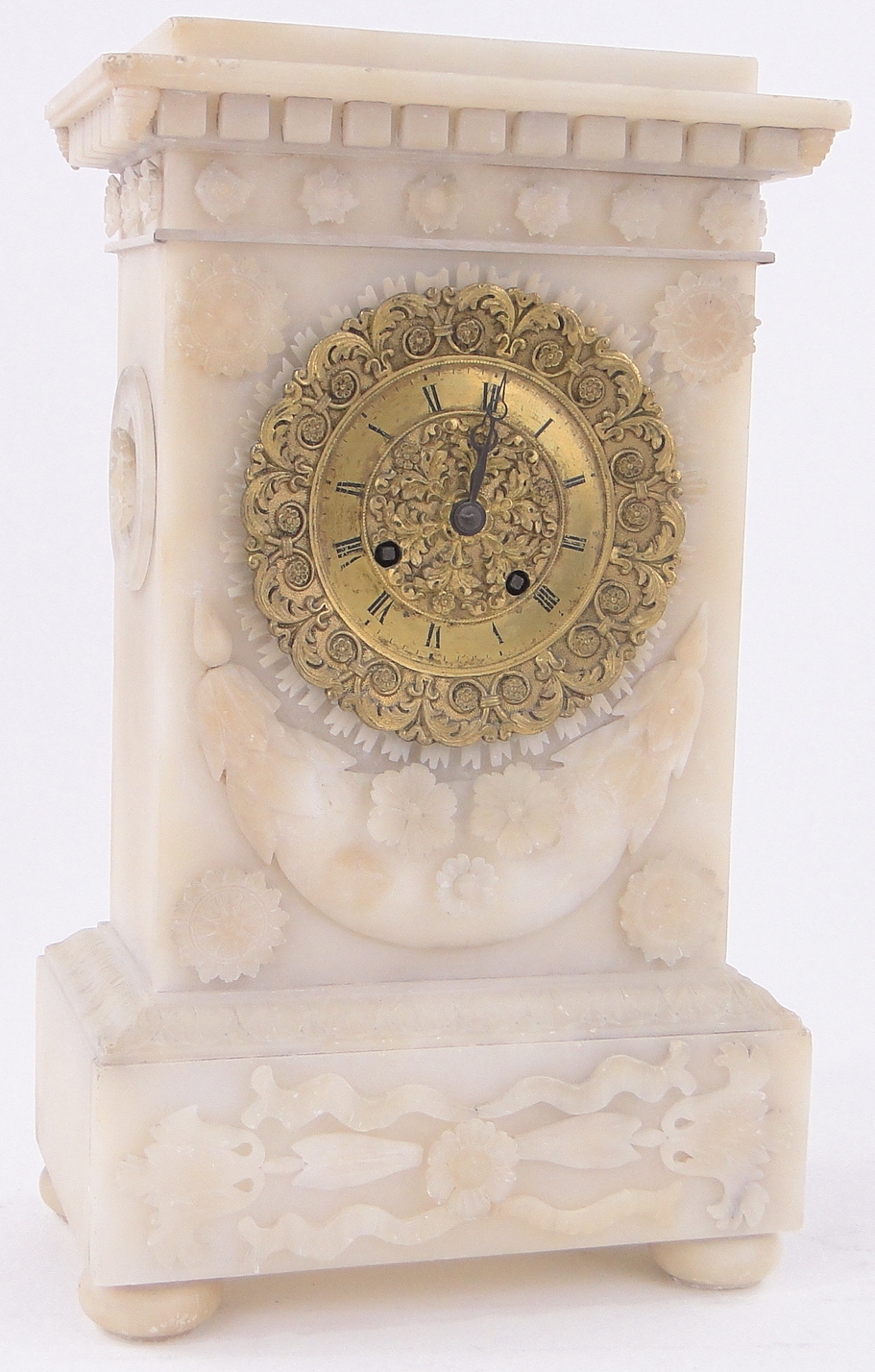 A 19th century relief carved alabaster cased mantel clock, with cast ormolu dial, height 33cm.