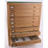 A 10-drawer butterfly collector's cabinet, with glass topped drawers,