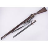 A 19th century flintlock rifle, length overall 124cm with original bayonet.