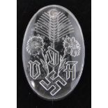 A German Third Reich pressed glass fund raising badge, height 3.5cm.