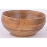 A turned fruit wood bowl, diameter 19cm.
