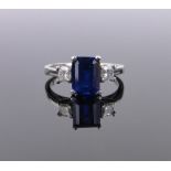 A 3 stone sapphire and diamond ring, platinum settings, sapphire height 8mm, size M.