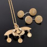 An ornate 18ct gold pendant and chain, 11g, width 55mm and a pair of unmarked gold cufflinks, 9.5g.