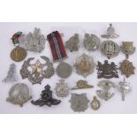 A Collection of military cap badges.