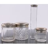 4 Silver topped toilet jars.