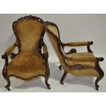 A pair of Victorian carved mahogany framed open armchairs.