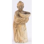 A Chinese carved ivory figure of a man holding a fish in a bowl, 18th/19th century,