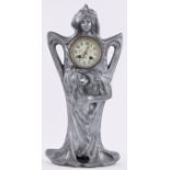 An Art Nouveau stylised white metal cased mantel clock, the case formed as Classical maidens,