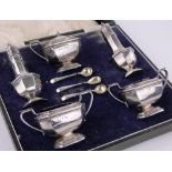 A large 5-piece silver cruet set, Birmingham 1937, pepperettes height 13cm.