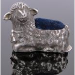 A modern silver sheep design pin cushion, length 50mm.