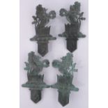 A set of 4 patinated bronze relief armorial wall decorations, height 46cm.