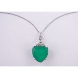 An 18ct white gold shield shaped emerald and diamond set pendant, emerald approx.
