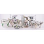 A quantity of continental porcelain items with cherub figures, all a/f and 3 Victorian pottery jugs,