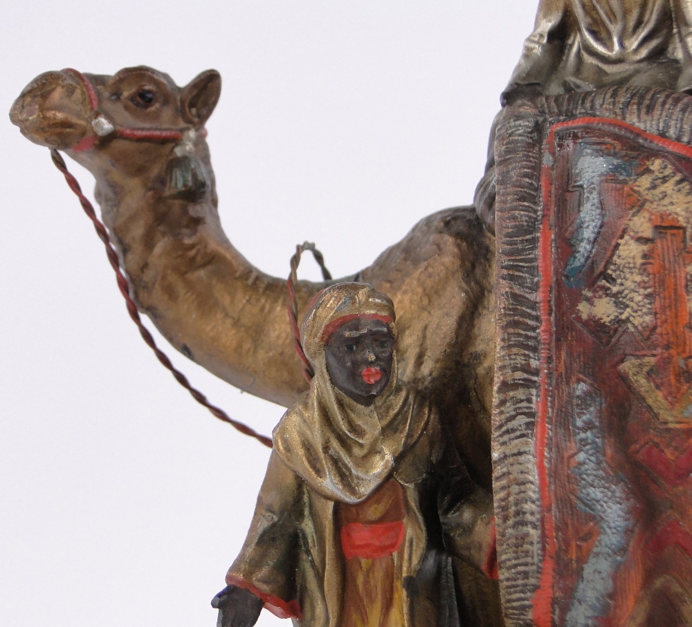 An Austrian painted spelter table lighter in the form of Arab carpet sellers and camel, - Image 3 of 3