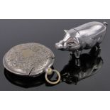 A Victorian pig design vesta case, length 6.5cm and another Victorian disc shaped vesta, (2).