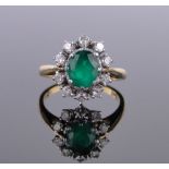 An 18ct gold emerald and diamond cluster ring, setting height 15mm, size Q.