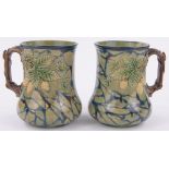 A pair of unusual Victorian Rye Pottery Hop ware mugs, with relief hop designs,